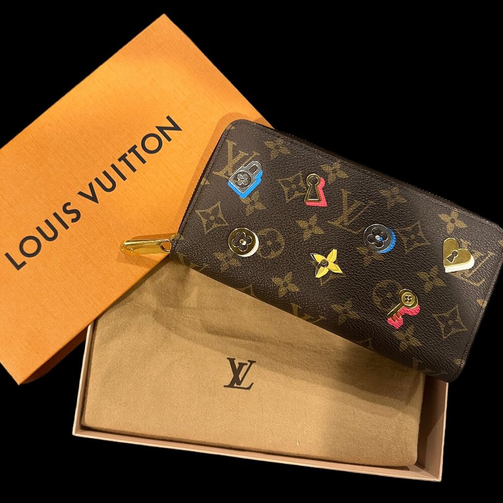 LOUIS VUITTON Monogram Love Lock Zippy Wallet.- EUC with Box and Dust Bag